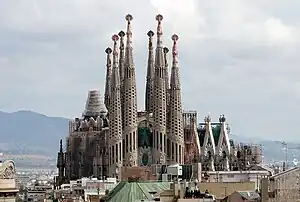 A large palace structure with many towers under construction.