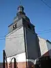 Geheel van Sint-Firminuskerk, omringende muur rond kerkhof en ensemble van de kerk, het kerkhof en de muur er rond heen