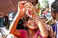 A forcedly displaced Rohingya girl queued and waiting with other hundreds to collect food and supplies at Kutupalong makeshift refugee camp.