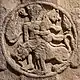 Hero fighting against lions, a motif of West-Asian origin, such as this one or this one.