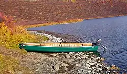 Square back canoe with a small outboard motor