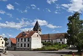 Schaffhouse-sur-Zorn's Rue de l'Ecole, with the Saint-Sébastien church in the background