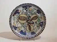 Dish with polychrome decor of pomegranates, 1930