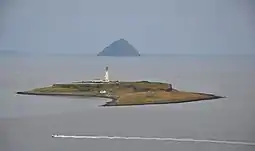 The isle of Pladda as seen from Arran, with Ailsa Craig in the distance