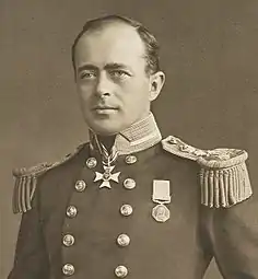 A man in ceremonial military uniform.