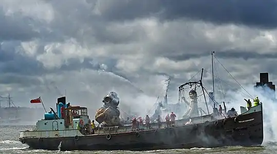 Royal de Luxe used a boat-float on the Mersey for three giant puppets in 2012