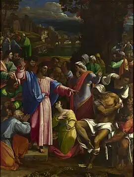 Realistic painting of a robed figure, arms extended, standing outside on a small platform among people doing various things such as talking to each other, but most of whom are looking at him.