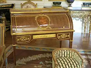 Louis XVI style roll-top desk of Marie-Antoinette; by Jean-Henri Riesener; 1784; oak and pine frame, sycamore, amaranth and rosewood veneer, bronze gilt; 103.6 x 113.4 cm; Louvre