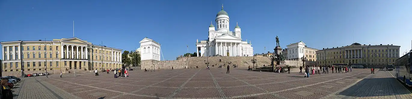 Panorama of the Helsinki Senate Square, designed by Carl Ludvig Engel. From left: the main building of University of Helsinki, Helsinki Cathedral, Government Palace. At the center is a statue of Alexander II by Walter Runeberg.