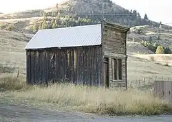 A side view of a false front building in Chesaw