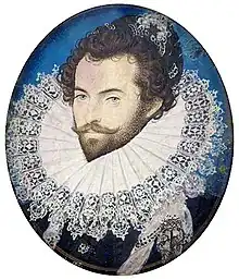 A head-and-shoulders portrait of Sir Walter Raleigh. He is wearing an extremely large ruff, and has his hair done up in curls. Underneath the ruff, he is wearing a black shirt.