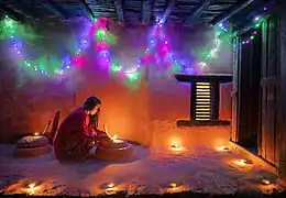 Image 28Woman lighting a diyo during Tihar, by Mithun Kunwar (edited by Radomianin) (from Wikipedia:Featured pictures/Culture, entertainment, and lifestyle/Religion and mythology)