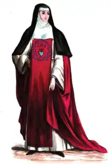 The religious habit of the Sisters of the Incarnate Word and Blessed Sacrament is white, with a red scapular and a black veil