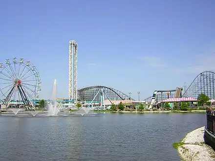 Waterfront view west from Jazz Plaza over Crescent City Basin; L–R: prominent rides include The Big Easy ferris wheel, Sonic Slam/Baou Blaster, and Mega Zeph