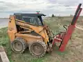 Skid steer post driver