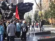 Members of the Socialist Resistance of Kazakhstan laying flowers at the memorial in Park of 28 Panfilov Guardsmen, which honours the Red Army soldiers who died in World War II