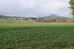 Fields, part of a central Sokołowiec and Ostrzyca hill in the background