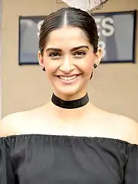 A picture of Sonam Kapoor during promotions of the film Neerja as she looks at the camera.