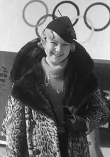 Photo of Henie wearing a fur coat