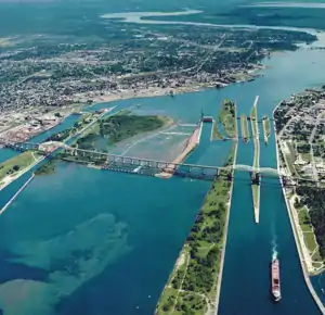 Aerial view of the St. Marys River; Whitefish Island is just to the left of the rapids.