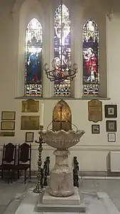 The baptismal font, in the shape of a seashell