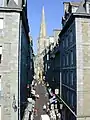 View up a typical city street towards the cathedral