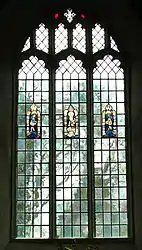 A leadlight window (18th-century-style) set with salvaged remnants of ancient stained glass.   England