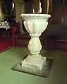 The baptismal font dates to 1771