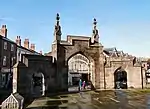 Gateway to Parish Church of St Mary and Fountain to Side