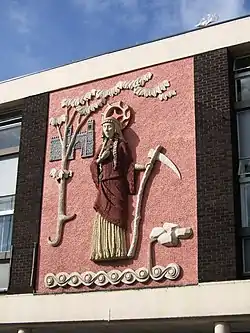 St. Sidwell of Exeter. Relief, on a shopping arcade in Sidwell Street, Exeter.