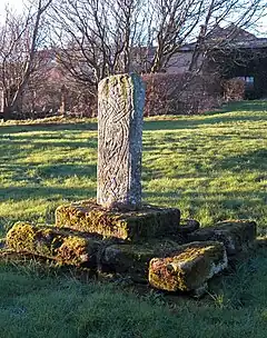 Cross in churchyard to north of Priory Church nave