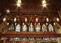 Wooden ceiling and the eastern wall of stained glass windows