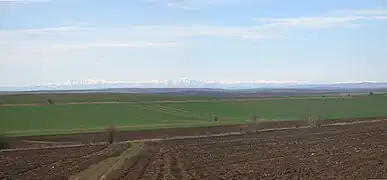 View across the Danubian Plain (Bulgaria) towards the central Balkan Mountains 90 km away