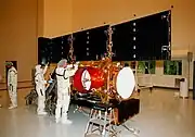 The solar arrays being checked in the Payload Hazardous Servicing Facility