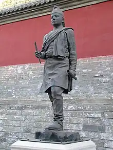 stone statue of Araniko outside the Miaoying Temply in Beijinh