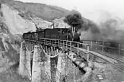 The steam train passing Zlaști valley viaduct around 1930-1940