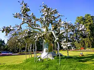 Steel tree with utensils by Subodh Gupta