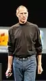 Steve Jobs wearing his signature black mock turtle neck by Issey Miyake