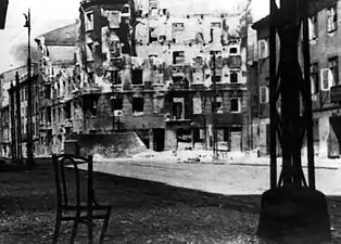 Stroop Collection, not in the report.Zamenhofa Street looking North at resistance in Gęsia 20 building.