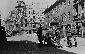 Stroop Collection, not in the report.Cannon on Zamenhofa Street shooting North at resistance in Gęsia 20 building