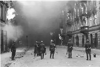 IPN copy #21Smoking out the Jews and BanditsWaffen SS troops at Nowolipie Street, between Smocza and Karmelicka Streets, with Nowolipie 34 on the right.