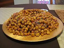 Struffoli is a Neapolitan dish made of deep fried balls of dough about the size of marbles.