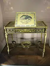 Writing table of Marie-Antoinette; by Adam Weisweiler; 1784; oak, ebony and sycamore veneer, Japanese lacquer, steel, bronze gilt; 73.7 x 81. 2 cm; Louvre