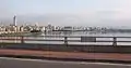 Taipei Bridge in 2008Photo is of the eastbound motorcycle/bicycle/pedestrian bridge looking south with a sign marking the border between Taipei City, a special municipality, and Taipei County in Taiwan Province (now New Taipei City)