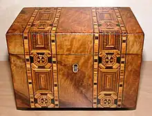 An English tea caddy decorated with wood inlay