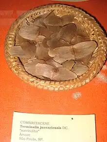 Photo of the seeds in a bowl on an orange table cloth with a label in front of the bowl