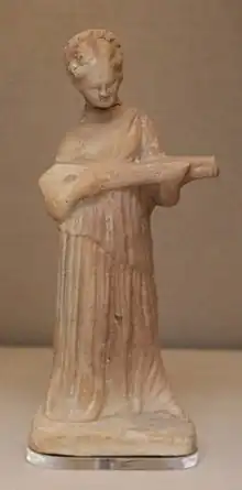 Terracotta figure of a woman playing a pandoura,  ca. 300 BC, Cyprus (British Museum)