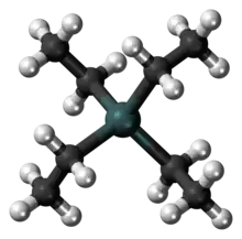 A gray-green sphere linked to four black spheres, each, in turn, linked also to three white ones