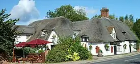 English pub names such as The Barley Mow (like this pub at Clifton Hampden) allude to the use of barley to make the beer available inside.