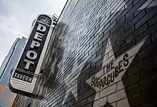 Vertical sign reading The Depot Tavern